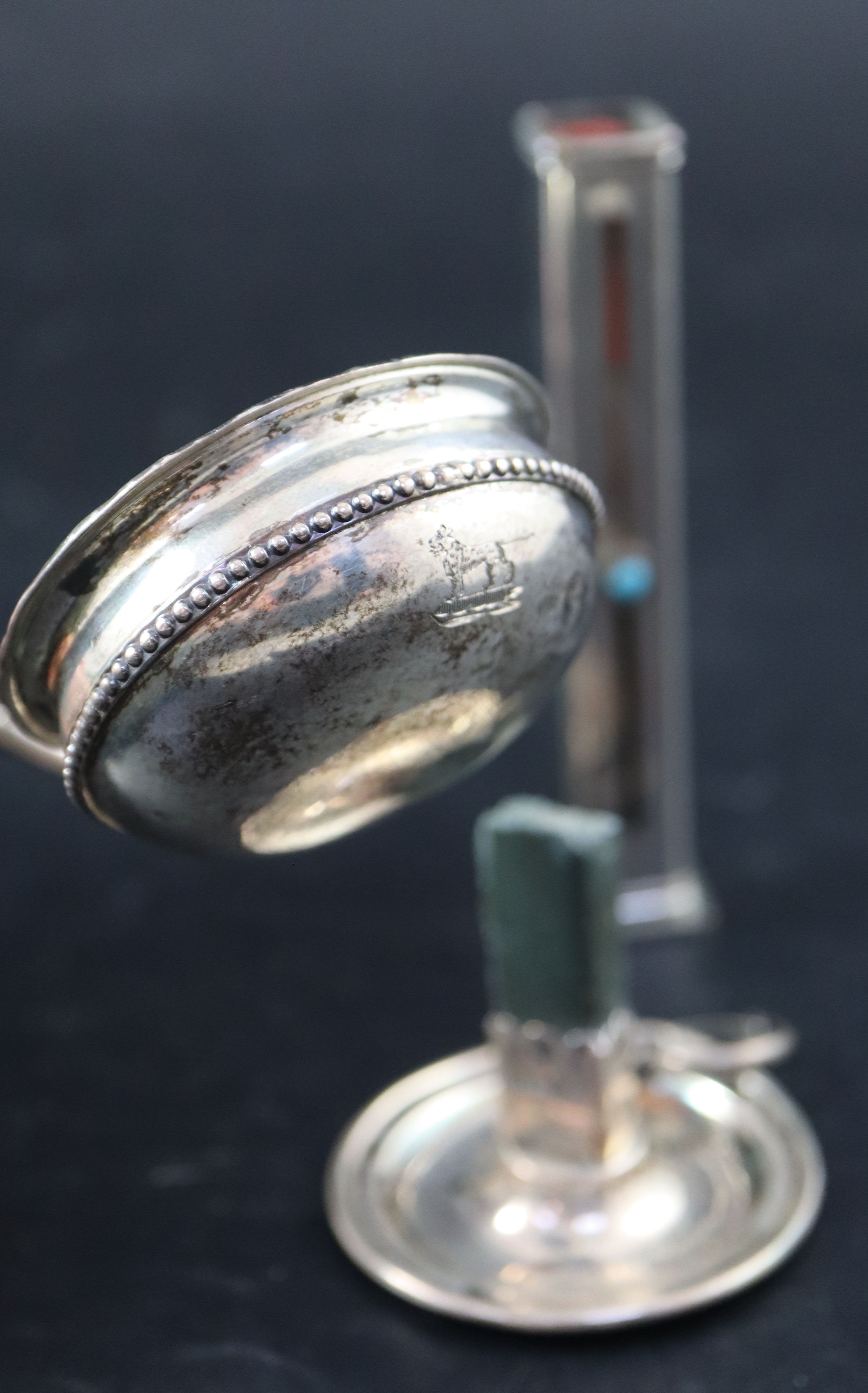 A George III white metal toddy ladle, 30.7cm (handle damaged) and two later sealing wax holders,